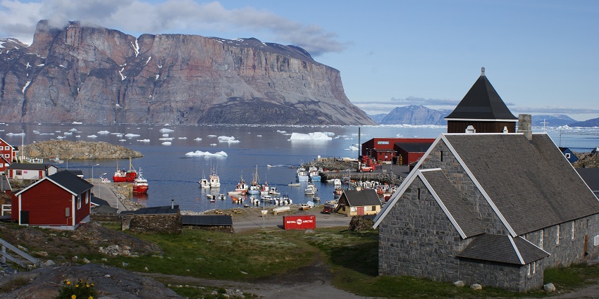An Image of the Unmmannaq, with houses built over the rocky mountains in Greenland