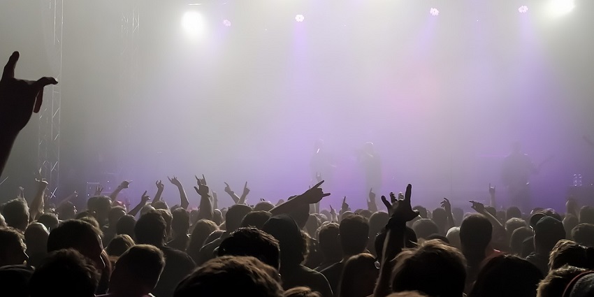 An image showing a concert with an engaged audience enjoying a live performance.