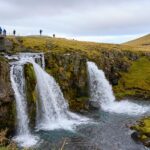 An image showing waterfalls cascading over rocks in Iceland, perfect for Valentine's Day in Iceland.