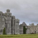 An image showing Ashford Castle by the lake, an ideal spot for Valentine’s Day in Ireland.