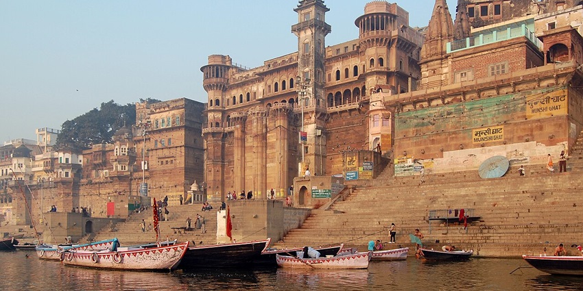 Varanasi ghats at sunrise with boats - one of the places to visit in India with family.