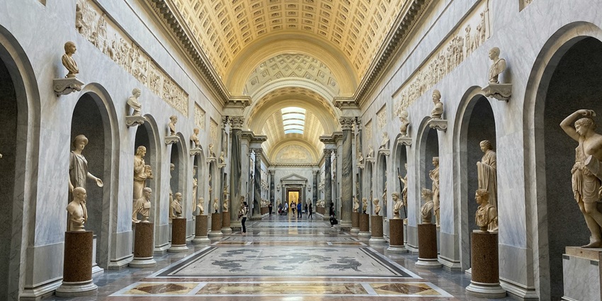The grand hallway filled with classical sculptures in an Art Museum in Italy