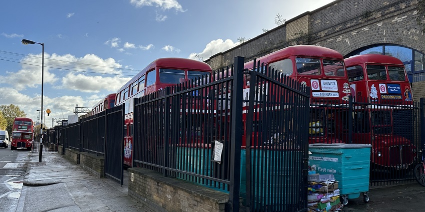 An Image of several vintage double-decker buses, best for experiencing the vintage tea tour in Dublin.