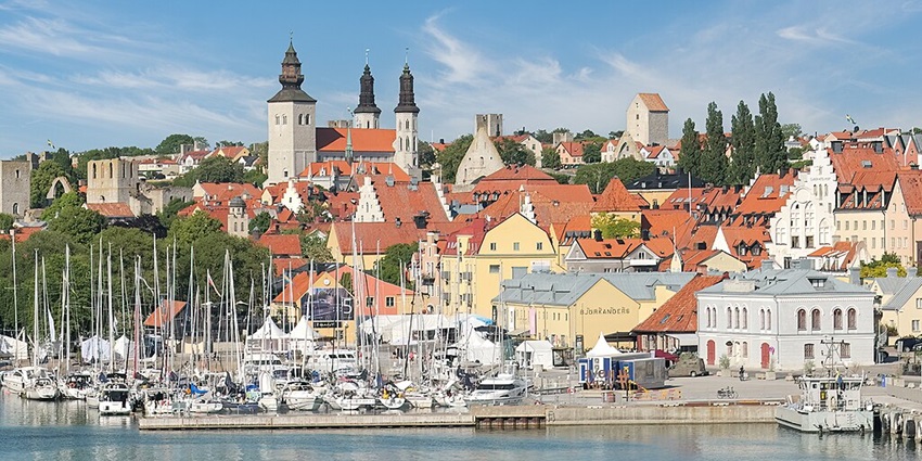An image showing the medieval town of Visby, featuring its historic walls and cobbled streets