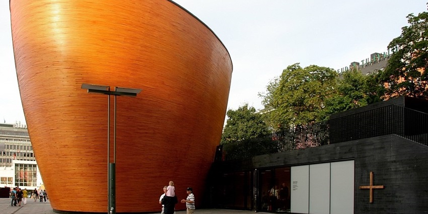 An image of the Kamppi Chapel, a famous place to visit in Helsinki, Finland