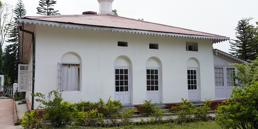 A picture of the Rabindra Bhavan in Kharagpur taken from the lush garden area of the venue