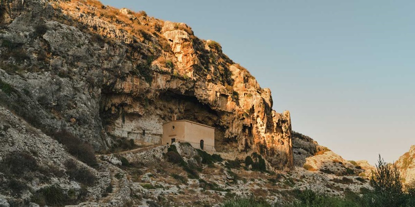 Visit the historic Church of St. Paul the Hermit nestled in Malta’s scenic Wied il-Għasri.