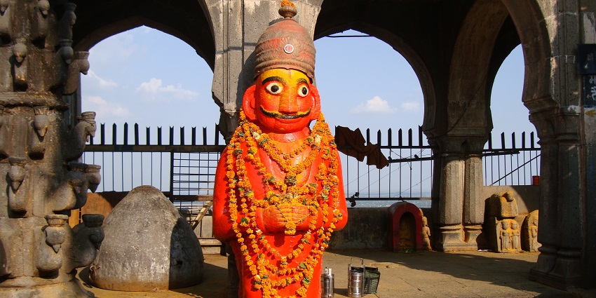 Beautiful idol of Khandoba Temple adorned with flowers and vibrant decorations