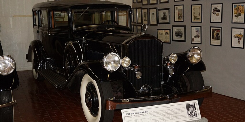 A beautiful 1931 classic black Pierce-Arrow series 41 vintage car is displayed in a museum.