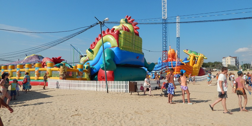 Popular beach with sandy shores, perfect for swimming and sunbathing.