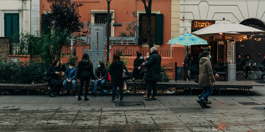 A visitor exploring the cobblestone streets at Trastevere, a top thing to do in Rome