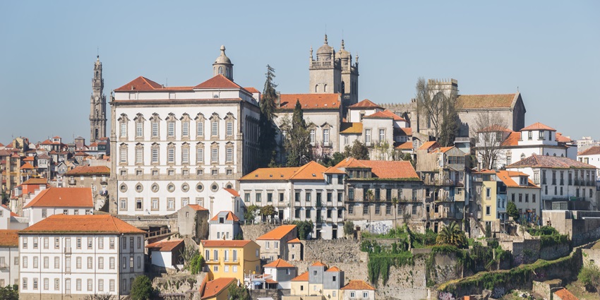 Sunset views over Porto’s skyline from Jardim do Morro, one of the best spots in Porto.