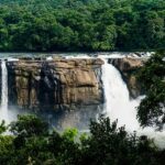 An image of Athirapally Falls, which is one of the famous waterfalls in South India