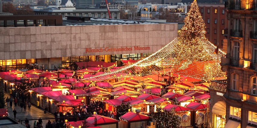 An image of a beautifully decorated Christmas market in Germany, an annual custom for the Locals.