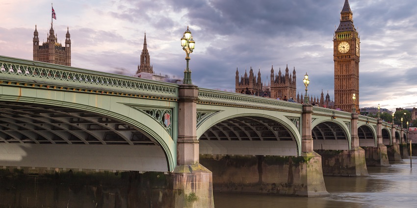 An Image of the Westminster Bridge with Big Ben and London Eye visible in the background