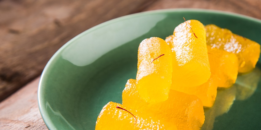 A mouth watering view of a bowl served with yellow petha in Agra, one of the best dishes.
