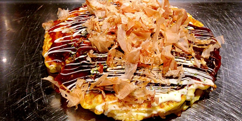 Hiroshima is famous for its unique take on okonomiyaki a savory pancake layered with ingredients.