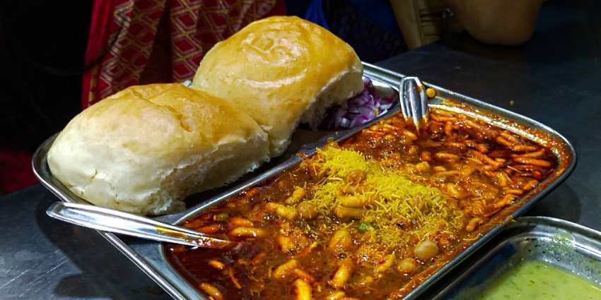 Thane's diverse food scene offers spicy, Indian dishes like Misal Pav.