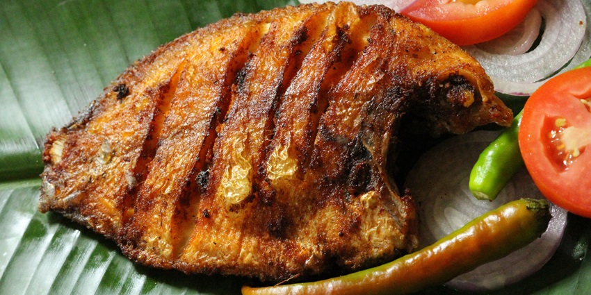 Spicy and flavourful Karimeen Pollichathu, a grilled Kerala delicacy wrapped in banana leaf