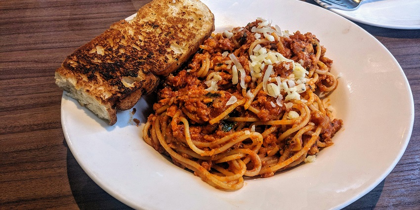 A view of spaghetti and bread at one of the restaurants in Bangalore city, Karnataka.