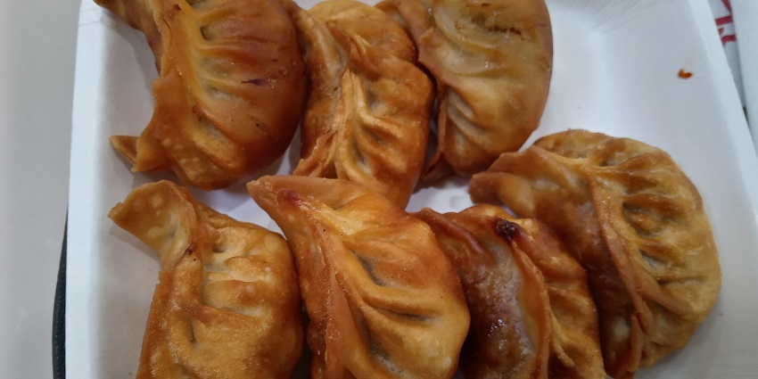 Image of Delicious momos at a restaurant served on a plate in a restaurant