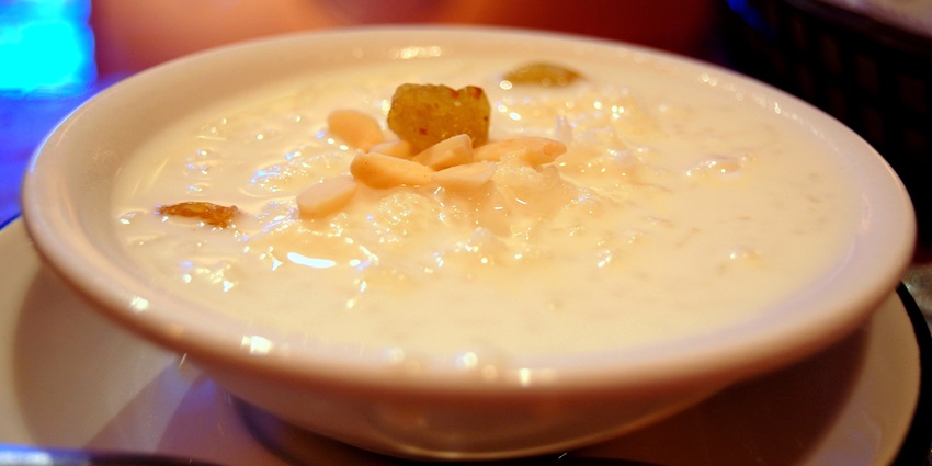 Savoring delicious Jhangora Ki Kheer at a restaurant near the temple in Uttarakhand.