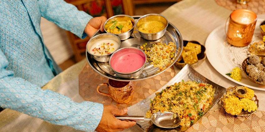 An image of a spread of traditional Bengali dishes served at a restaurant near Adyapith Temple.
