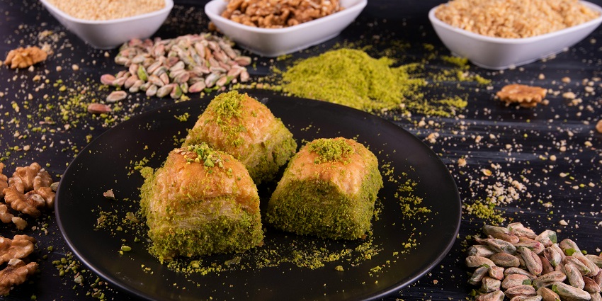 Image of delectable Baklava Dessert served on a black coloured plate