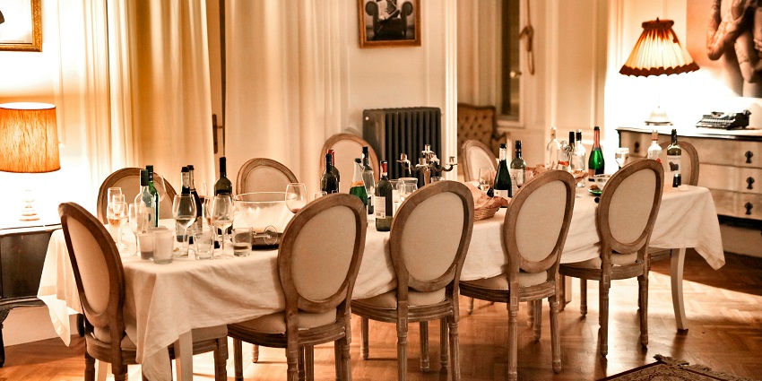 An image showing a restaurant dining area with brown chairs and tables set.