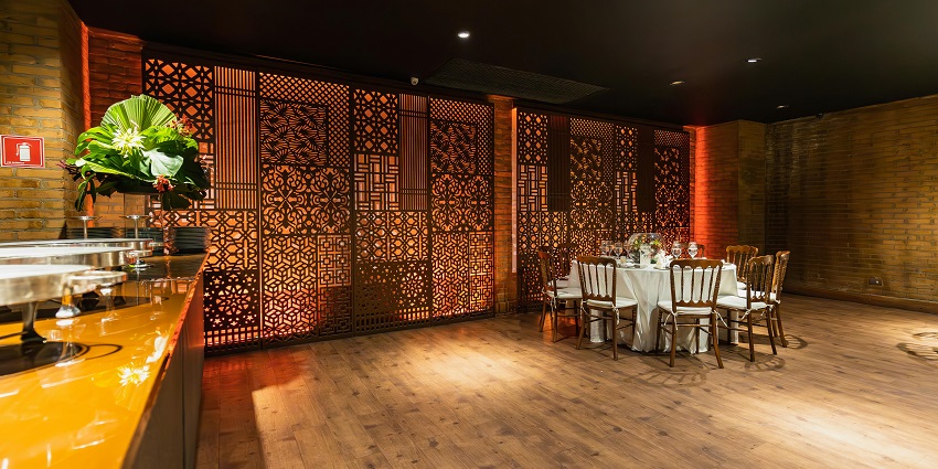 An image showing a celebration-ready restaurant adorned with elegant decorations and table settings