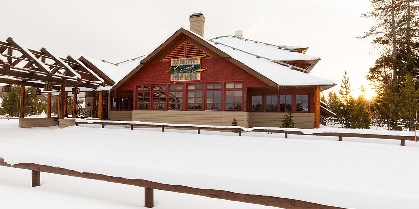 Wooden snow lodge on the snow-covered land near the largest lake in Canada.