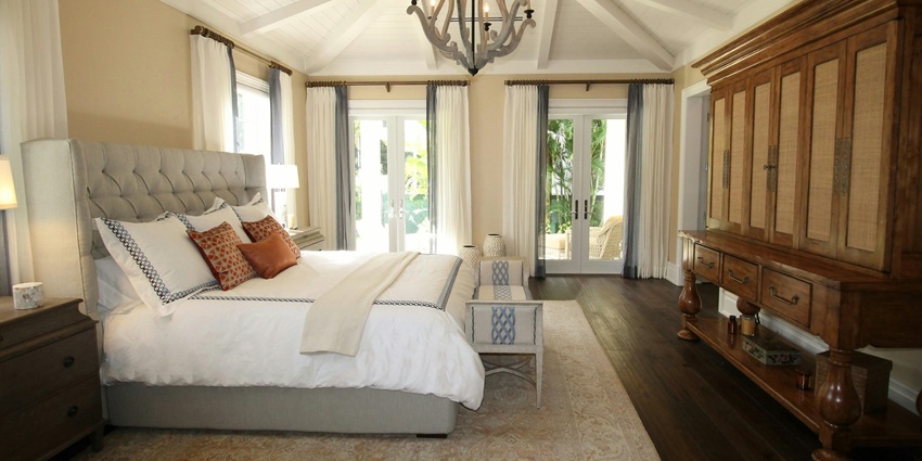 An image showing a view of a beautiful hotel room with greenery view outside the window