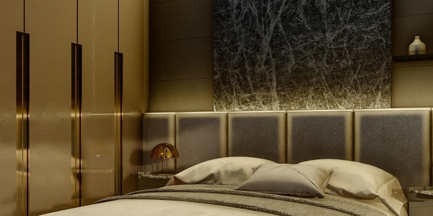 An image showing a hotel room with a neatly arranged bed, furniture, and interior design elements.