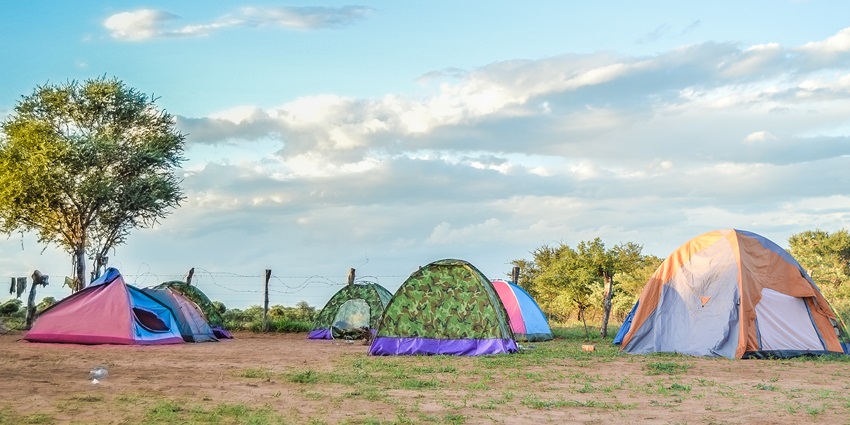Tents set up in Virunga National Park, surrounded by forests and lush greenery.