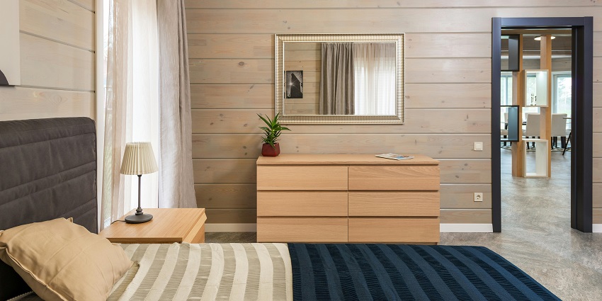 An image showing a contemporary hotel room featuring a cosy bed and elegant furnishings