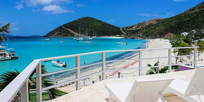 Image of White Bay beach, a postcard perfect beach with vibrant blue waters and bars