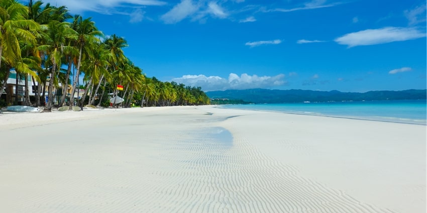 Serene beach known for its soft sands and calm waves.