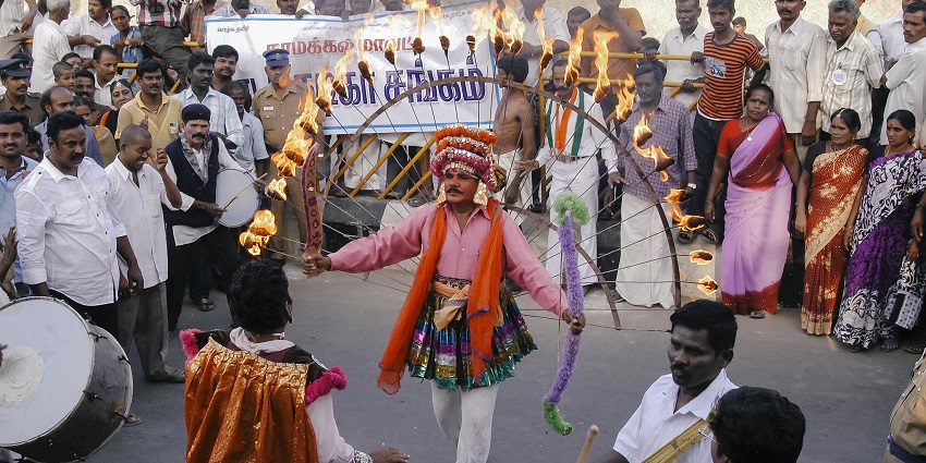 A man dancing with fire at a Pongal Festival in Namakkal.