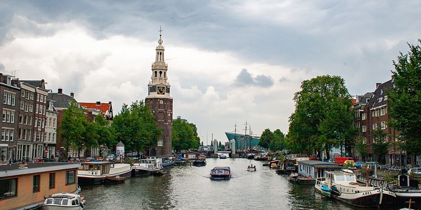 Things to do in the Netherlands include exploring historic buildings and picturesque boat views.