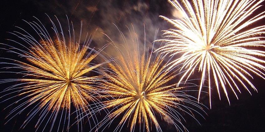 Image of fireworks at night with vibrant and sparkling lights right above for evening celebrations