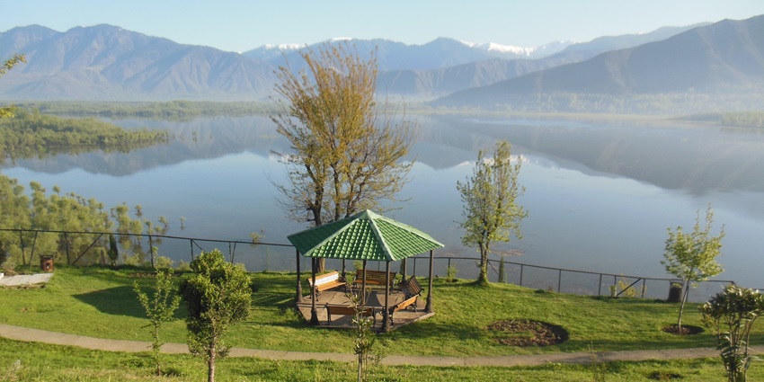 One of the lakes in Jammu and Kashmir with serene waters and a mountain backdrop.