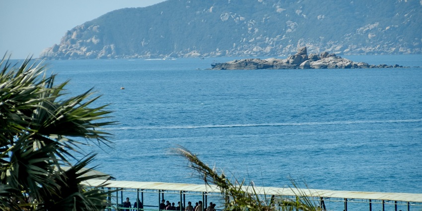 An image of the Yalong Bay with clear blue water, one of the best beaches in China