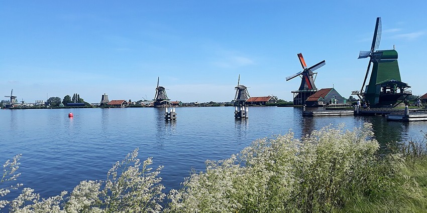 Open-air museum featuring traditional Dutch windmills and wooden houses