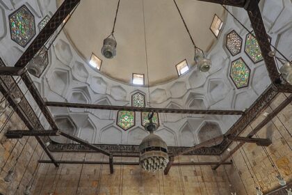 An image of the Al Saleh Mosque in Yemen taken during the night with the lighting on it.