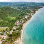 Aerial view of Cebu beaches boasting crystal-clear water, white sand, and coastal views.