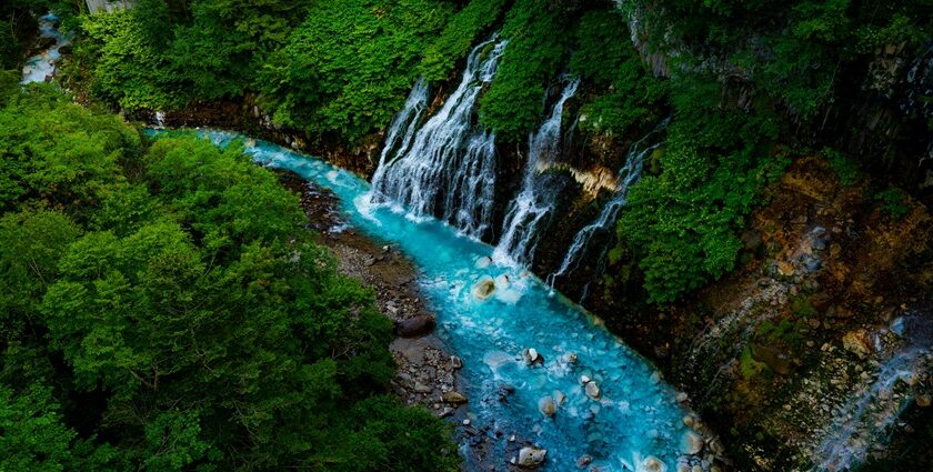 A glimpse of Giessbach Waterfalls descending into Lake Brienz amidst the Alps.