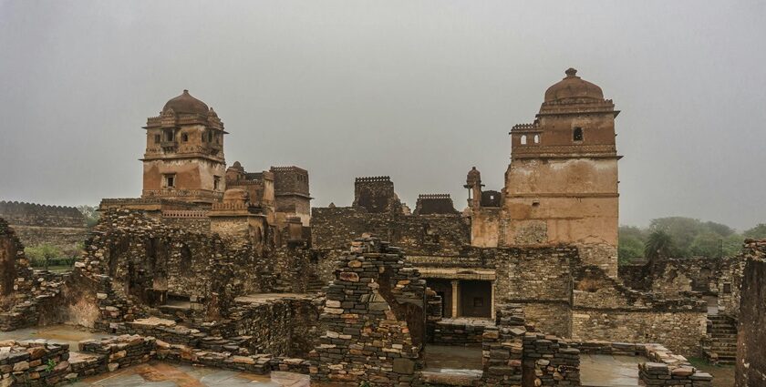 An image of Chittorgarh Fort showing ancient stone structures under a cloudy sky.