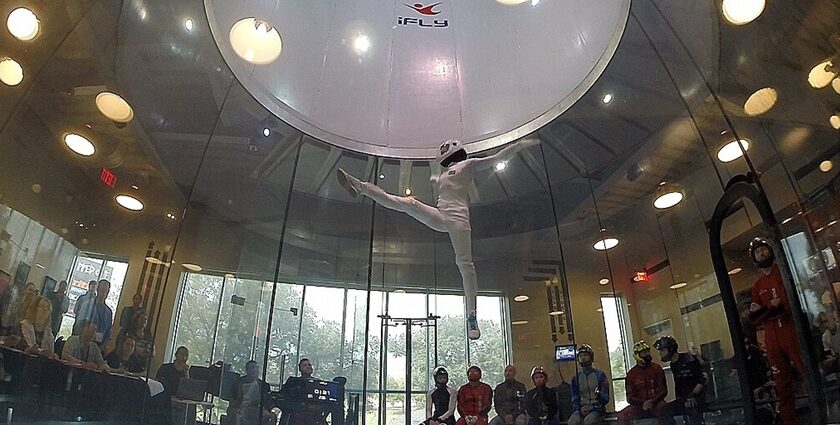 An image showing a person engaged in skydiving, an extreme sport similar to indoor skydiving in India.