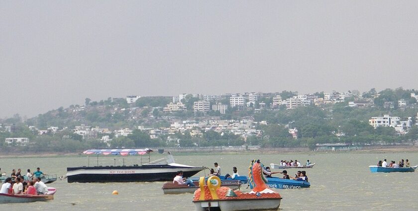 An image of Upper Lake in Madhya Pradesh with people enjoying boating and the surrounding