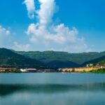 A scenic view of one of the most beautiful lakes in Pune, with golden sunset reflections on the water